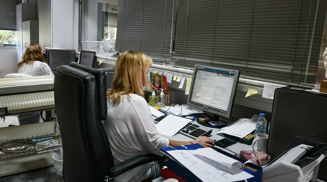 An employee working in his office